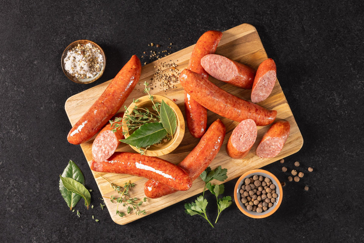 Opa's smoked sausage links on a wooden board